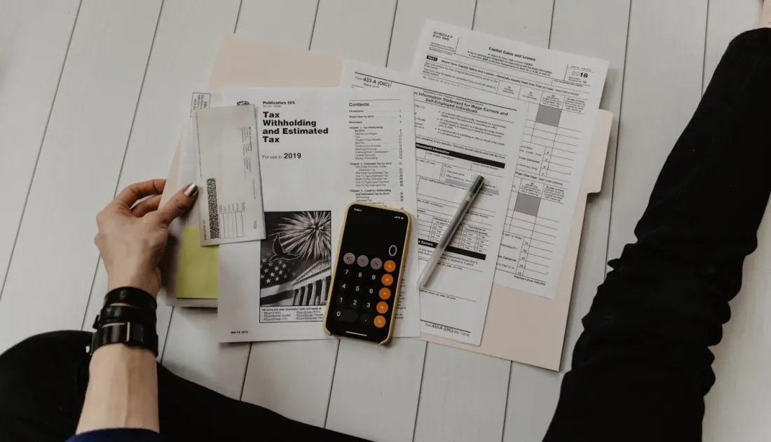 Cost breakdown notes beside a calculator.