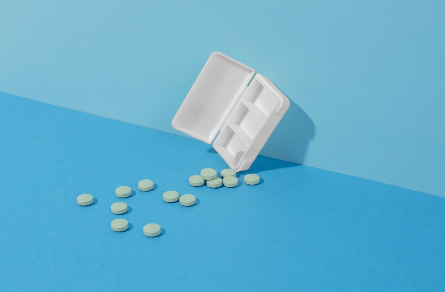 Unbranded medication packaging and tablets for pill formulation questions.