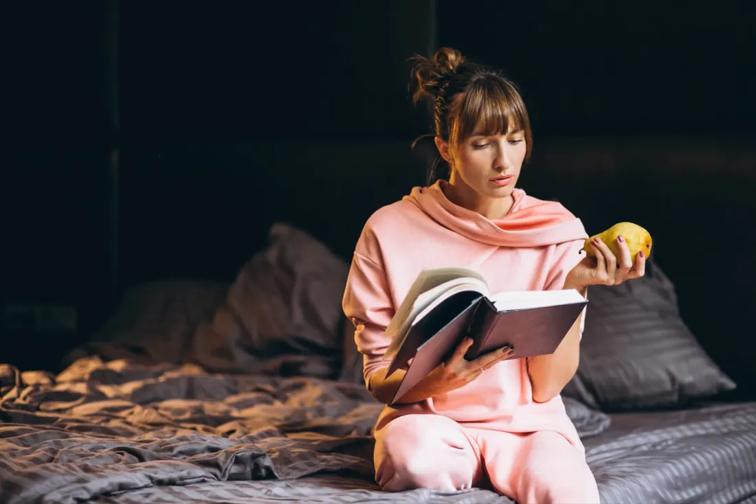 A calm wind-down routine, reading in bed before sleep.