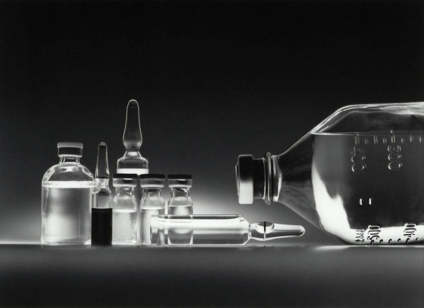 Clinical medication and supply check on a white desk, representing safety verification.